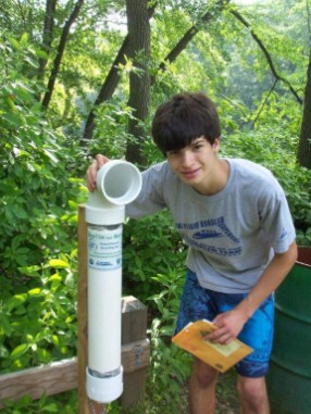 Jake Peacock, student at Haddonfiled Memorial High School, at the Hopkins Pond collecton bin